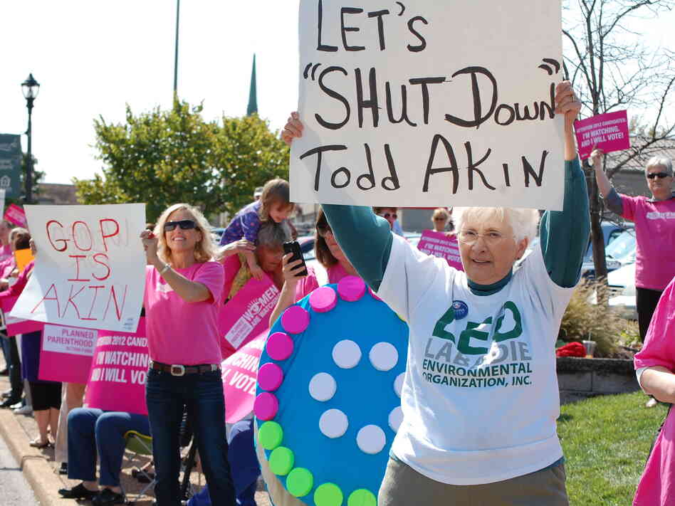 Planned Parenthood organized a protest outside a fundraiser for Todd Akin on Monday.