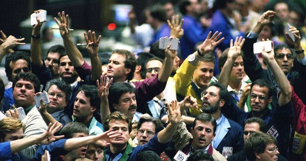 Traders work in the bond pit at the Chicago Board of Trade in 1995. In recent decades, much of the trading has left the pits and gone electronic.