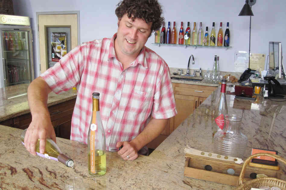 Maine Mead Works owner Ben Alexander pours a sample of his dry mead.