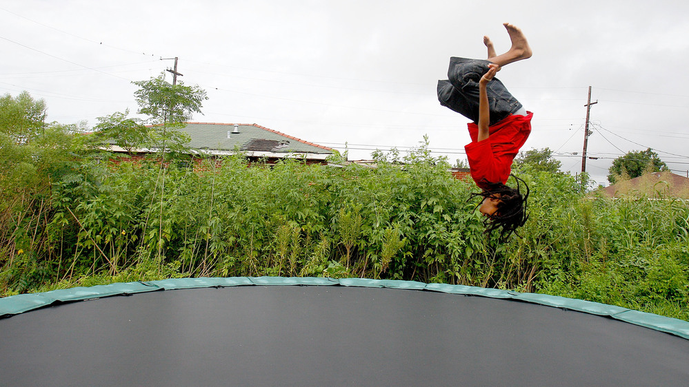 Eric Wiltz cavorts on a  trampoline in New Orleans in  2010. Everything is fun and games on the backyard attractions until someone gets hurt, a leading group of pediatricians says.