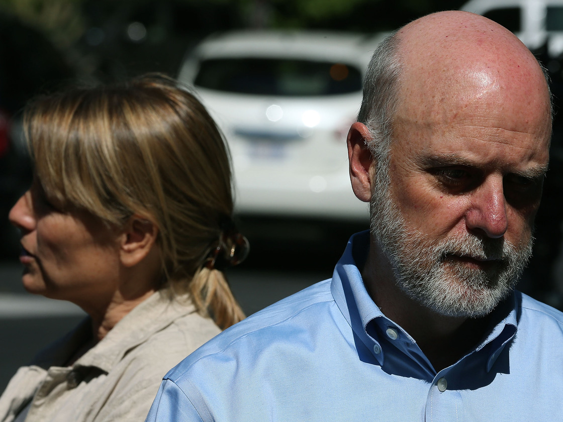 Dennis Kelly (right), director of the Smithsonian's National Zoo, and Suzan Murray, chief veterinarian, discuss the panda cub's death.