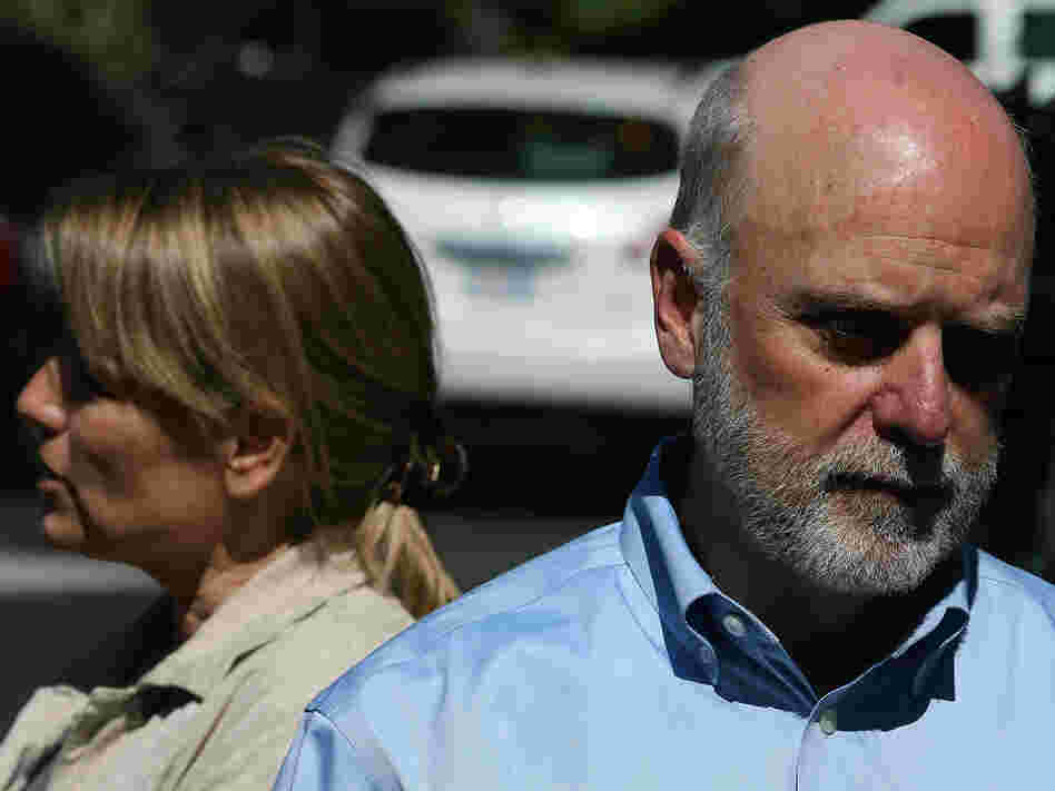 Dennis Kelly (right), director of the Smithsonian's National Zoo, and Suzan Murray, chief veterinarian, discuss the panda cub's death.