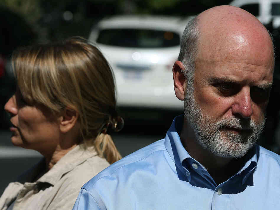Dennis Kelly (right), director of the Smithsonian's National Zoo, and Suzan Murray, chief veterinarian, discuss the panda cub's death.