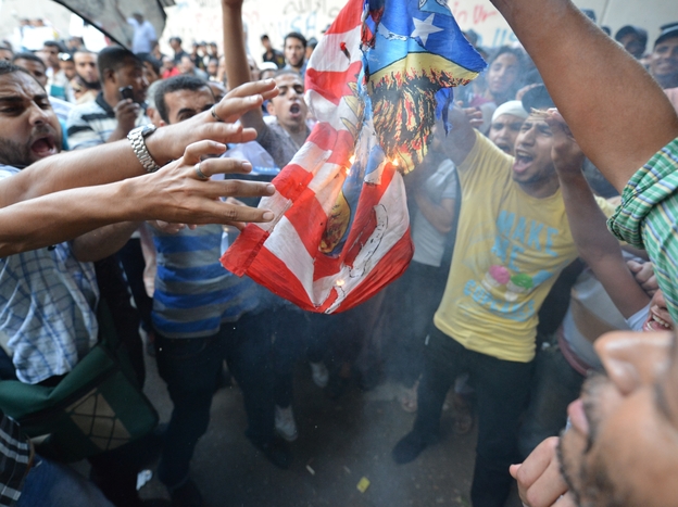 Egyptian protesters burn the US flag during a demonstration against a film deemed offensive to Islam on September 12, 2012 outside the US embassy in Cairo.