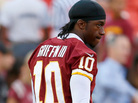 Washington Redskins quarterback Robert Griffin III watches from the sidelines. RG3 as he is known has a fan in other thirds like Frank Deford. Washington Redskins quarterback Robert Griffin III watches from the sidelines. RG3 as he is known has a fan in other thirds like Frank Deford.