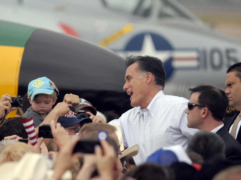 Republican presidential nominee Mitt Romney shakes hands at an aircraft museum in Pueblo, Colo., Monday.
