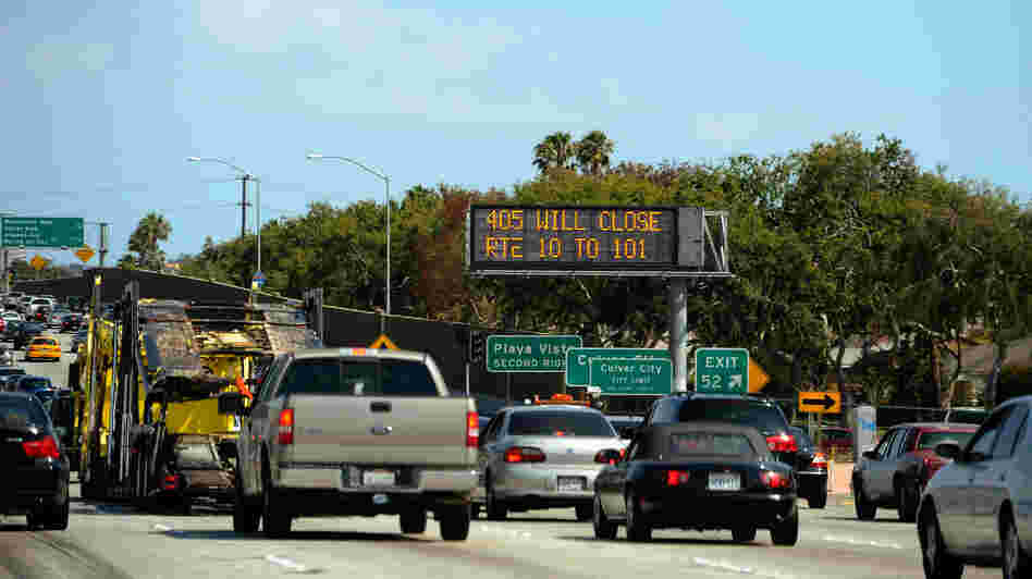 Carmageddonin' It? In a photo from last year, a traffic signs alerts motorists on Interstate 405 that the freeway will be shut down for two days in July for demolition of the Mulholland Bridge. The city is bracing for Carmegeddon II, scheduled for this weekend.