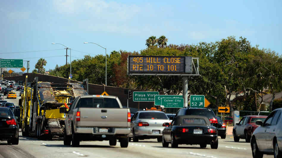 Carmageddonin' It? In a photo from last year, a traffic signs alerts motorists on Interstate 405 that the freeway will be shut down for two days in July for demolition of the Mulholland Bridge. The city is bracing for Carmegeddon II, scheduled for this weekend.