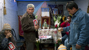 A family celebrates a religious festival in the Calvary neighborhood of Potosi, at the foot of Cerro Rico, on Aug. 18.
