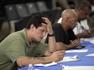 Job seekers fill out applications Aug. 21 at a construction job fair in New York. Polls show voters want the presidential candidates to provide more details on how they would reduce unemployment, change tax policy and alter government spending. Job seekers fill out applications Aug. 21 at a construction job fair in New York. Polls show voters want the presidential candidates to provide more details on how they would reduce unemployment, change tax policy and alter government spending.