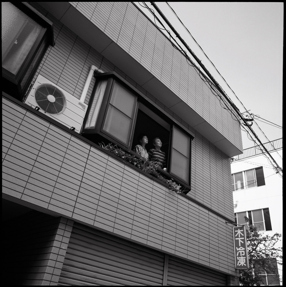 Taniguchi is seen with her sister at their family home, which was rebuilt in the same location where it had stood in 1945. Taniguchi had never heard her sister talk about her experience during the bombing until they were interviewed by photographer Peter Blakely in 2005.