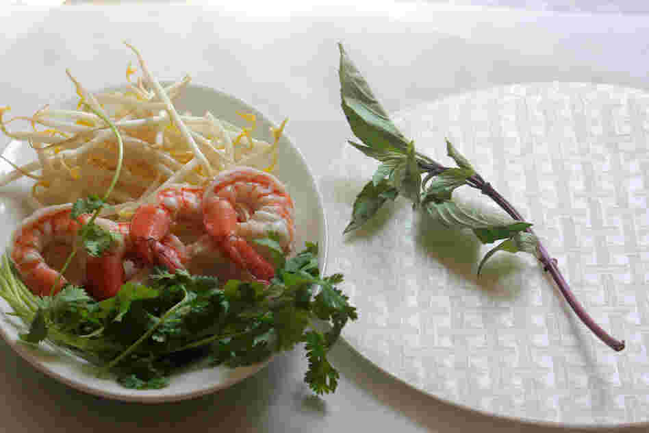 Ingredients for Classic Summer Rolls, including bean sprouts, shrimp, rice paper and fresh mint and cilantro