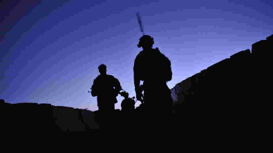 U.S. troops from the 2nd Battalion, 87th Infantry Regiment patrol at dawn in Kandalay, Afghanistan on Aug. 4, 2011. A worldwide stand down for troops to take part in suicide prevention training Thursday is part of the Army's response to an alarming suicide rate of nearly one per day.