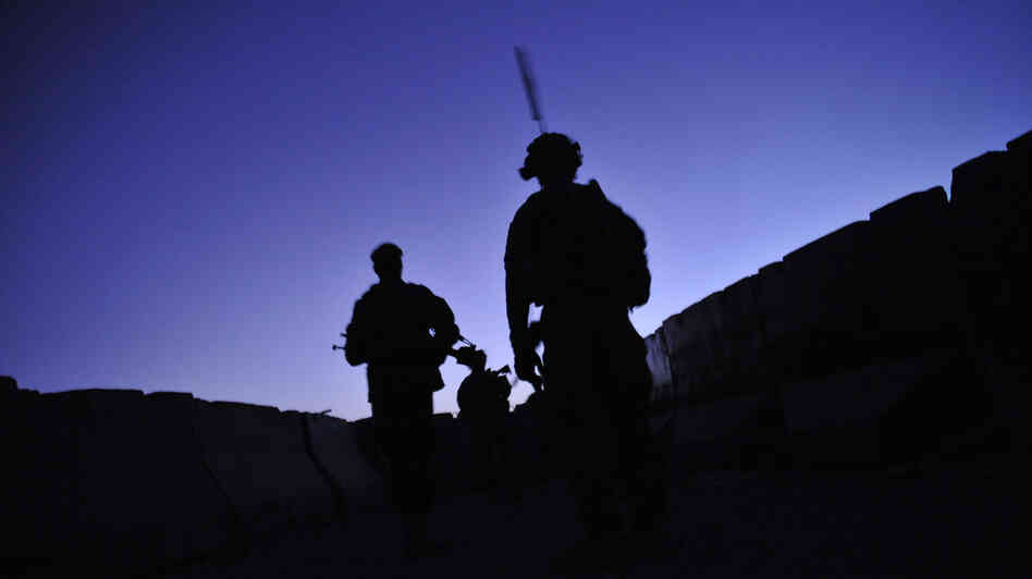 U.S. troops from the 2nd Battalion, 87th Infantry Regiment patrol at dawn in Kandalay, Afghanistan on Aug. 4, 2011. A worldwide stand down for troops to take part in suicide prevention training Thursday is part of the Army's response to an alarming suicide rate of nearly one per day.