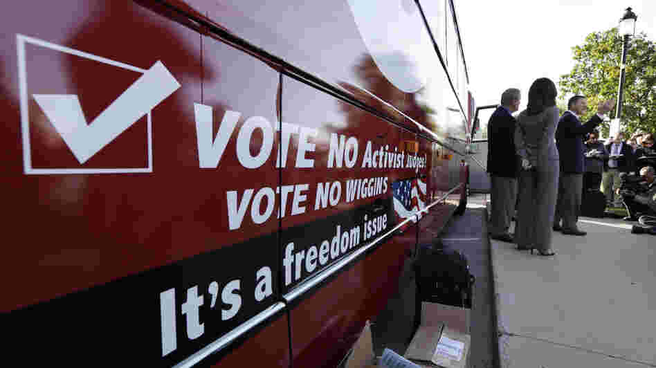 Bob Vander Plaats, president of The Family Leader (right) speaks before a bus tour to urge Iowans to vote state Supreme Court Justice David Wiggins off the bench, in Des Moines, Iowa, on Monday.