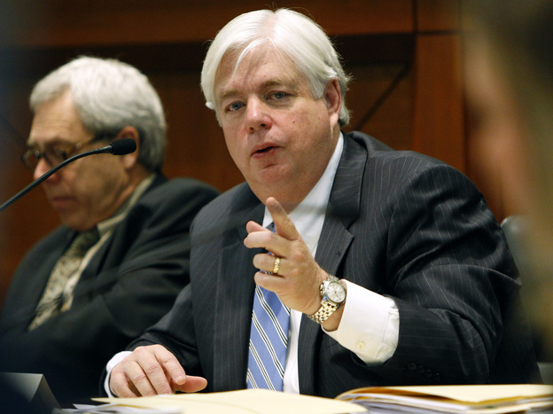 Iowa Supreme Court Justice David Wiggins, right, faces a retention vote Nov. 6.