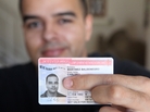 Carlos Martinez, 30, shows off his new work permit, which he received after applying for the Deferred Action for Childhood Arrivals program. Carlos Martinez, 30, shows off his new work permit, which he received after applying for the Deferred Action for Childhood Arrivals program.
