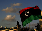 Libyans watch the protest against Ansar al-Shariah Brigades and other Islamic militias, in Benghazi on Sept. 21. The recent attack that killed the U.S. ambassador and three other Americans has sparked a backlash among frustrated Libyans against the heavily armed gunmen, including Islamic extremists, who run rampant in their cities. Libyans watch the protest against Ansar al-Shariah Brigades and other Islamic militias, in Benghazi on Sept. 21. The recent attack that killed the U.S. ambassador and three other Americans has sparked a backlash among frustrated Libyans against the heavily armed gunmen, including Islamic extremists, who run rampant in their cities.
