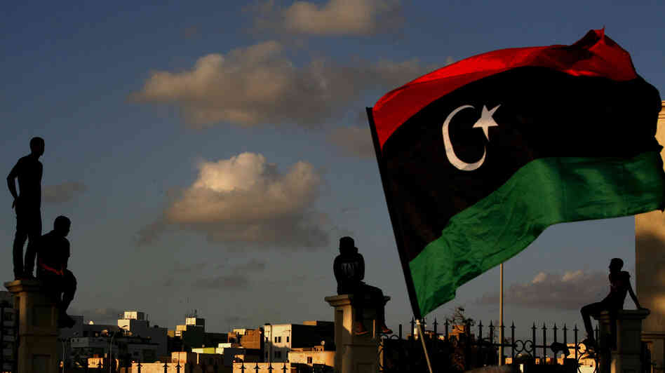 Libyans watch the protest against Ansar al-Shariah Brigades and other Islamic militias, in Benghazi on Sept. 21. The recent attack that killed the U.S. ambassador and three other Americans has sparked a backlash among frustrated Libyans against the heavily armed gunmen, including Islamic extremists, who run rampant in their cities. Libyans watch the protest against Ansar al-Shariah Brigades and other Islamic militias, in Benghazi on Sept. 21. The recent attack that killed the U.S. ambassador and three other Americans has sparked a backlash among frustrated Libyans against the heavily armed gunmen, including Islamic extremists, who run rampant in their cities.