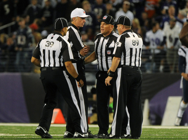 Things haven't been going well for these guys: Some of the NFL's replacement referees, during a Sept. 23 game between the New England Patriots and Baltimore Ravens.