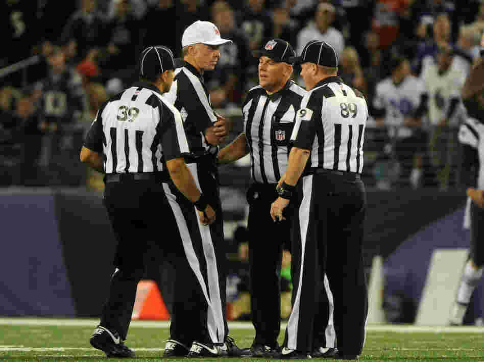 Things haven't been going well for these guys: Some of the NFL's replacement referees, during a Sept. 23 game between the New England Patriots and Baltimore Ravens.