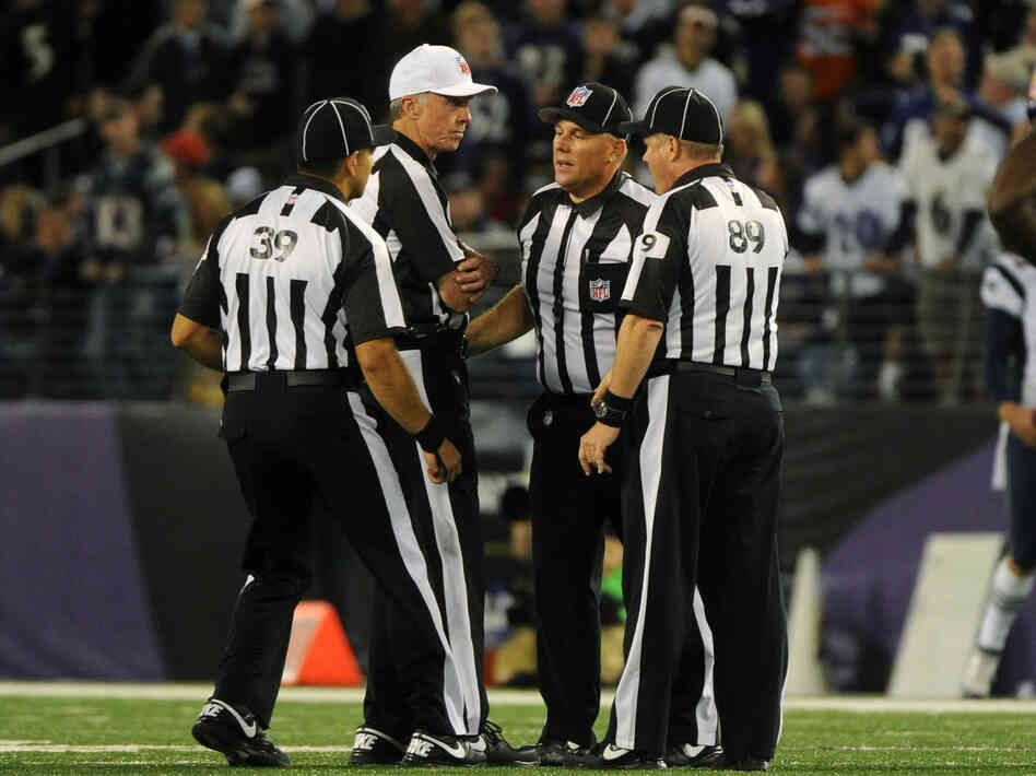 Things haven't been going well for these guys: Some of the NFL's replacement referees, during a Sept. 23 game between the New England Patriots and Baltimore Ravens.