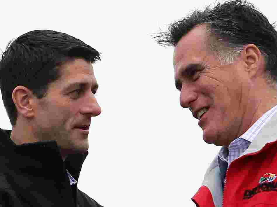 Presidential candidate Mitt Romney and his running mate, Rep. Paul Ryan, share a moment during a campaign rally in Vandalia, Ohio.