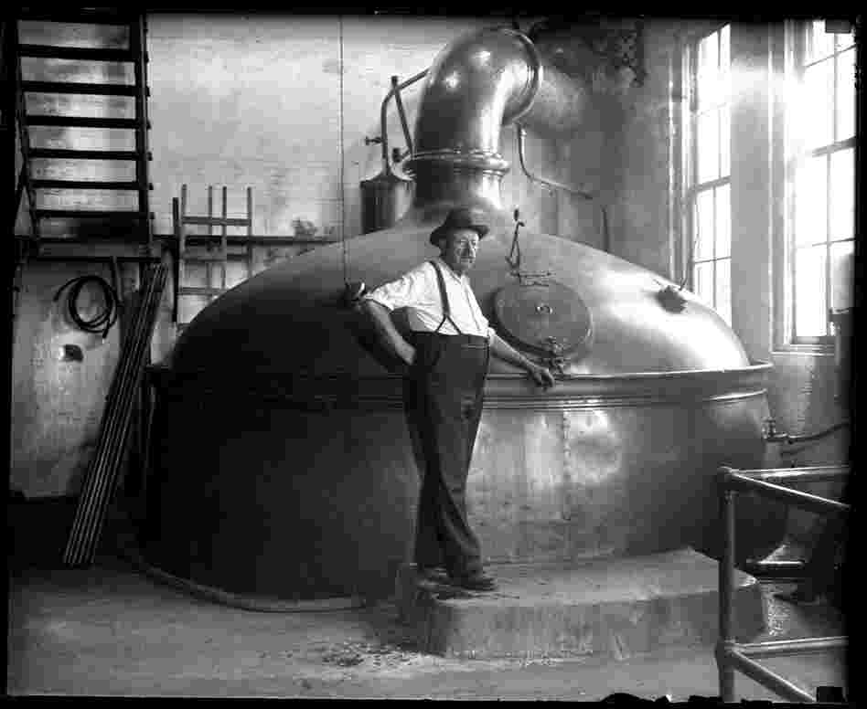 Conrad Griesser, brewmaster for Reisch Brewery in Springfield, stands in front of a brew kettle with a 360-barrel capacity. After the repeal of Prohibition in 1933, the Reisch family raised $250,000 to refurbish the plant with new equipment. The State Journal published a package of pictures on July 8, 1934 just as they were reopening. The brewery closed in 1966.