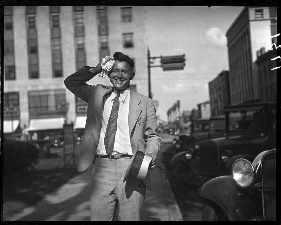 A heat wave that saw temperatures in the upper 90s for 11 days in July 1932, caused several deaths statewide. Frank Dillon wipes perspiration from his brow while walking along Adams Street on July 22, 1932.