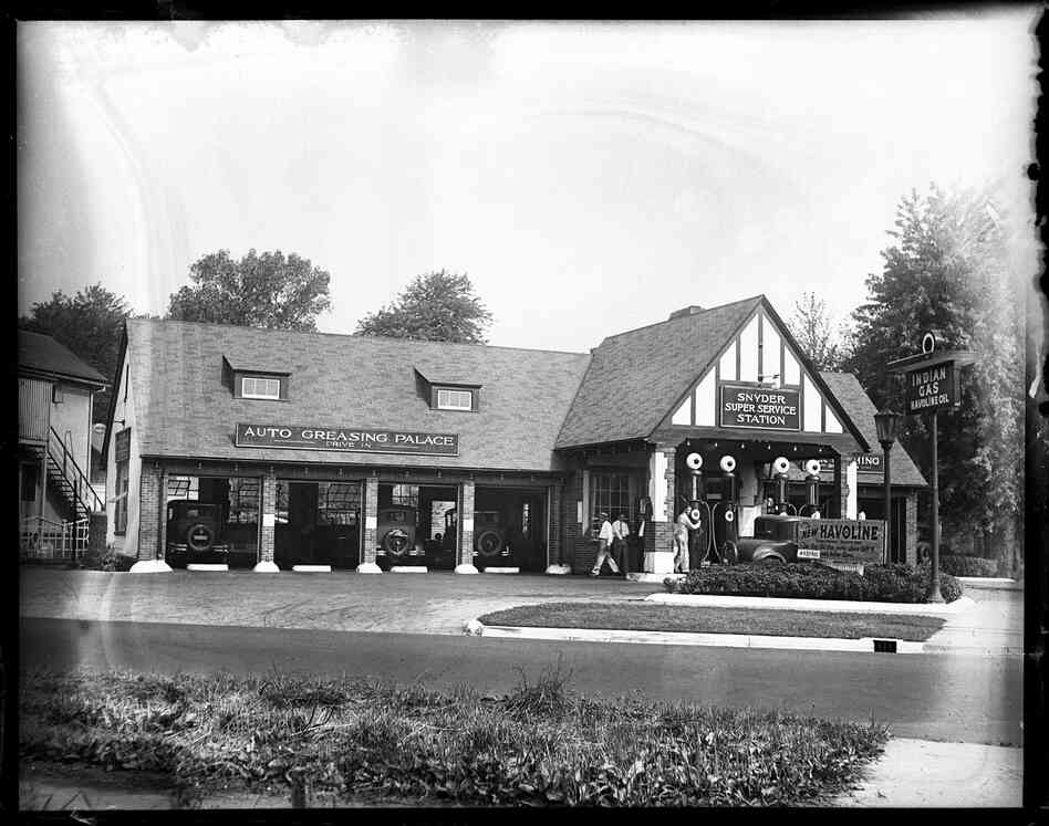 Snyder Super Service Station, Fifth Street and South Grand Avenue. The design of early filling stations evolved from offering just gas and having a basic shed, to providing shelter for the attendant, to being designed to fit into a residential setting. As stations added auto servicing capabilities, they were built in the form of a house with a service bay and softened with a landscaped lot. 