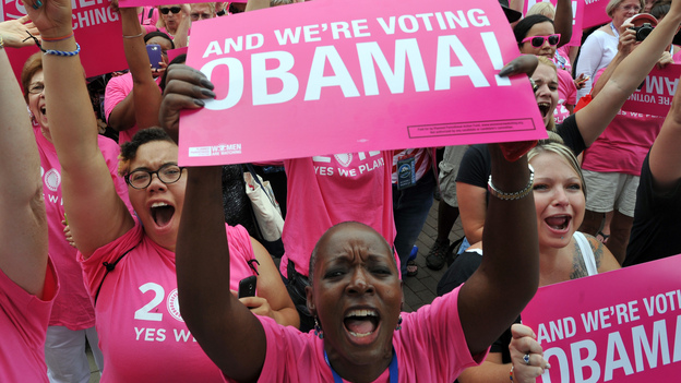 Supporters of Planned Parenthood wave banners during a rally for President Obama in Charlotte, N.C., on Sept. 4, ahead of the opening of the Democratic National Convention.