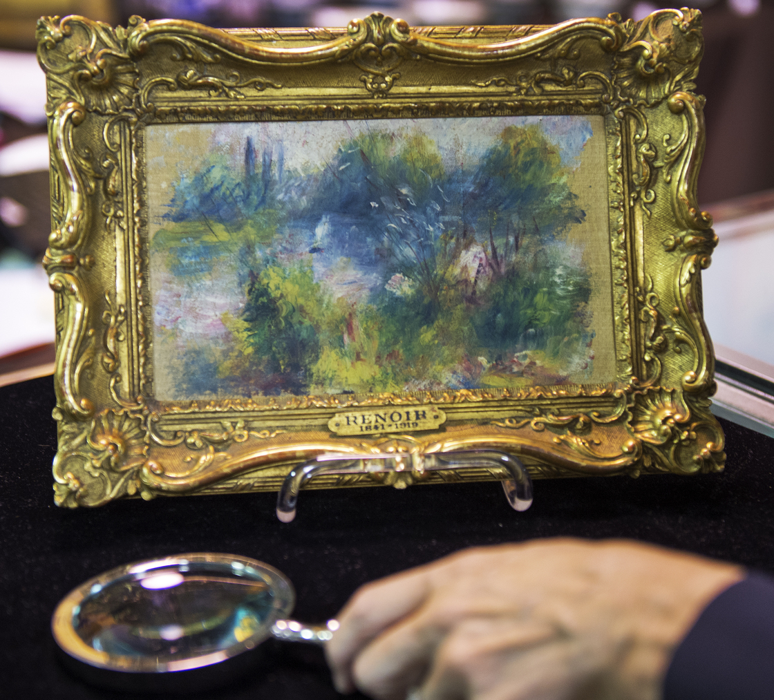 This weekend's auction of a flea-market find that turned out to be a work by French Impressionist master Pierre-Auguste Renoir has been put on hold, after evidence turned up the painting had been pilfered from a Baltimore museum decades ago.
