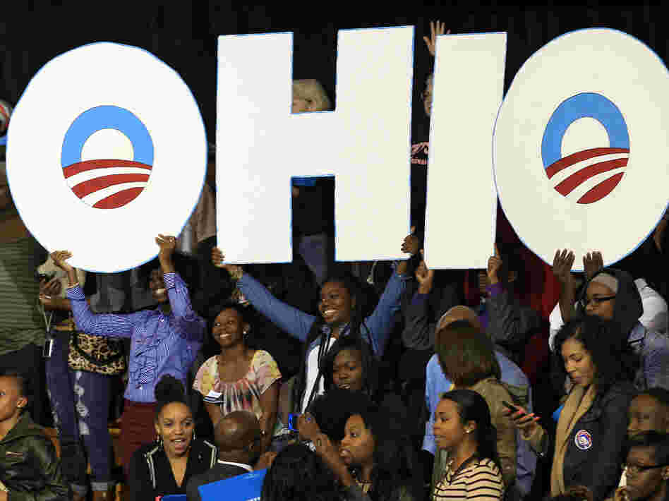 Supporters hold up an Ohio sign as President Obama speaks at a campaign event at Kent State University on Wednesday in Kent, Ohio.