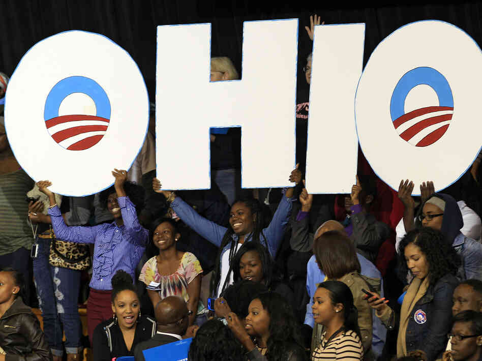 Supporters hold up an Ohio sign as President Obama speaks at a campaign event at Kent State University on Wednesday in Kent, Ohio.