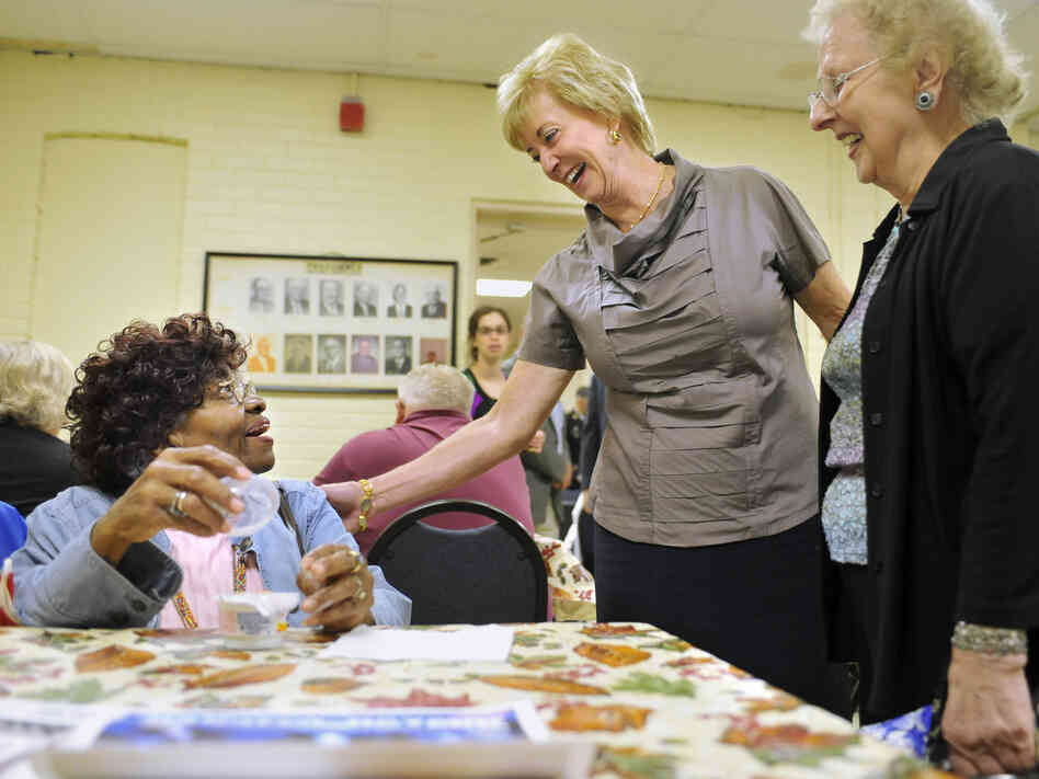 Linda McMahon (center) visits a senior center in Naugatuck, Conn., this month.