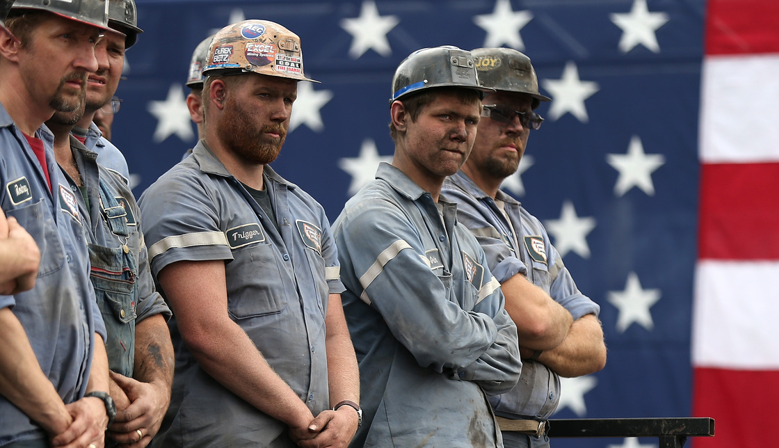 Coal miners listened as GOP presidential nominee Mitt Romney spoke during a rally last month in Beallsville, Ohio. Both Romney and President Obama have made the state a focal point of their campaigns.