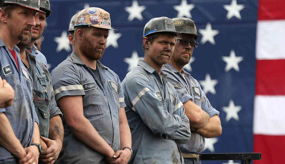 Coal miners listened as GOP presidential nominee Mitt Romney spoke during a rally last month in Beallsville, Ohio. Both Romney and President Obama have made the state a focal point of their campaigns.