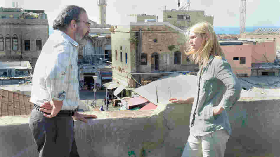 A phone call from her former boss, Saul (Mandy Patinkin), delivers Carrie Mathison (Claire Danes) back into the action of Homeland's second season. A phone call from her former boss, Saul (Mandy Patinkin), delivers Carrie Mathison (Claire Danes) back into the action of Homeland's second season.