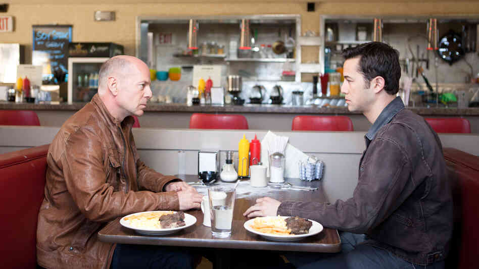 Bruce Willis and Joseph Gordon-Levitt play different versions of the same character in the time-travel thriller Looper.