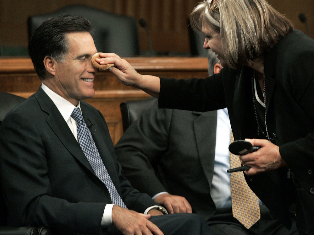 Mitt Romney has makeup applied before a discussion on Capitol Hill on Sept. 14, 2005.