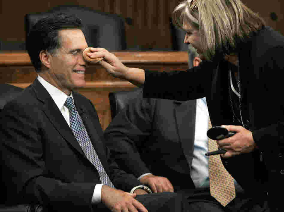 Mitt Romney has makeup applied before a discussion on Capitol Hill on Sept. 14, 2005.