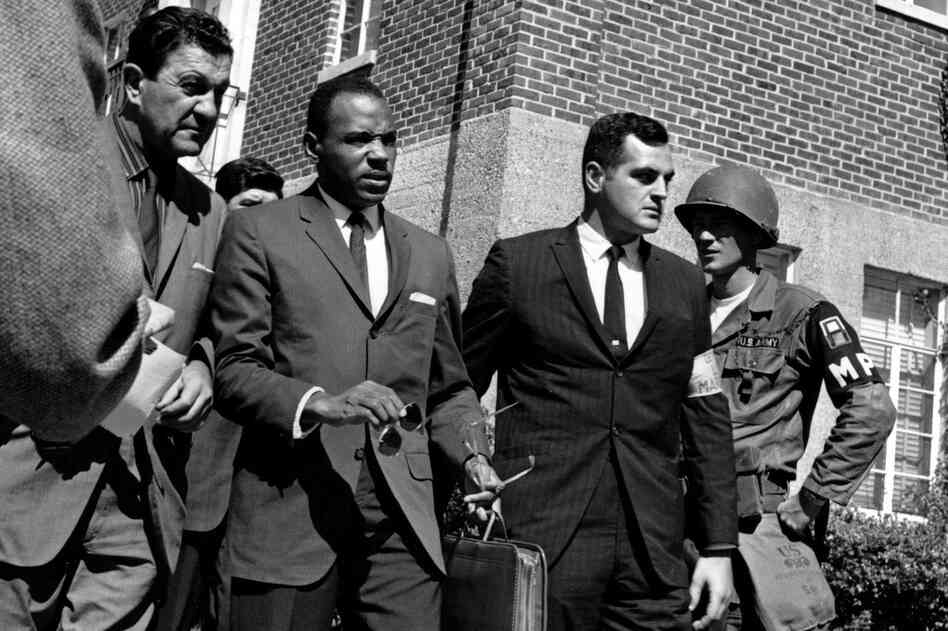 Meredith, center with briefcase, is escorted to the University of Mississippi campus by U.S. marshals on Oct. 1, 1962.