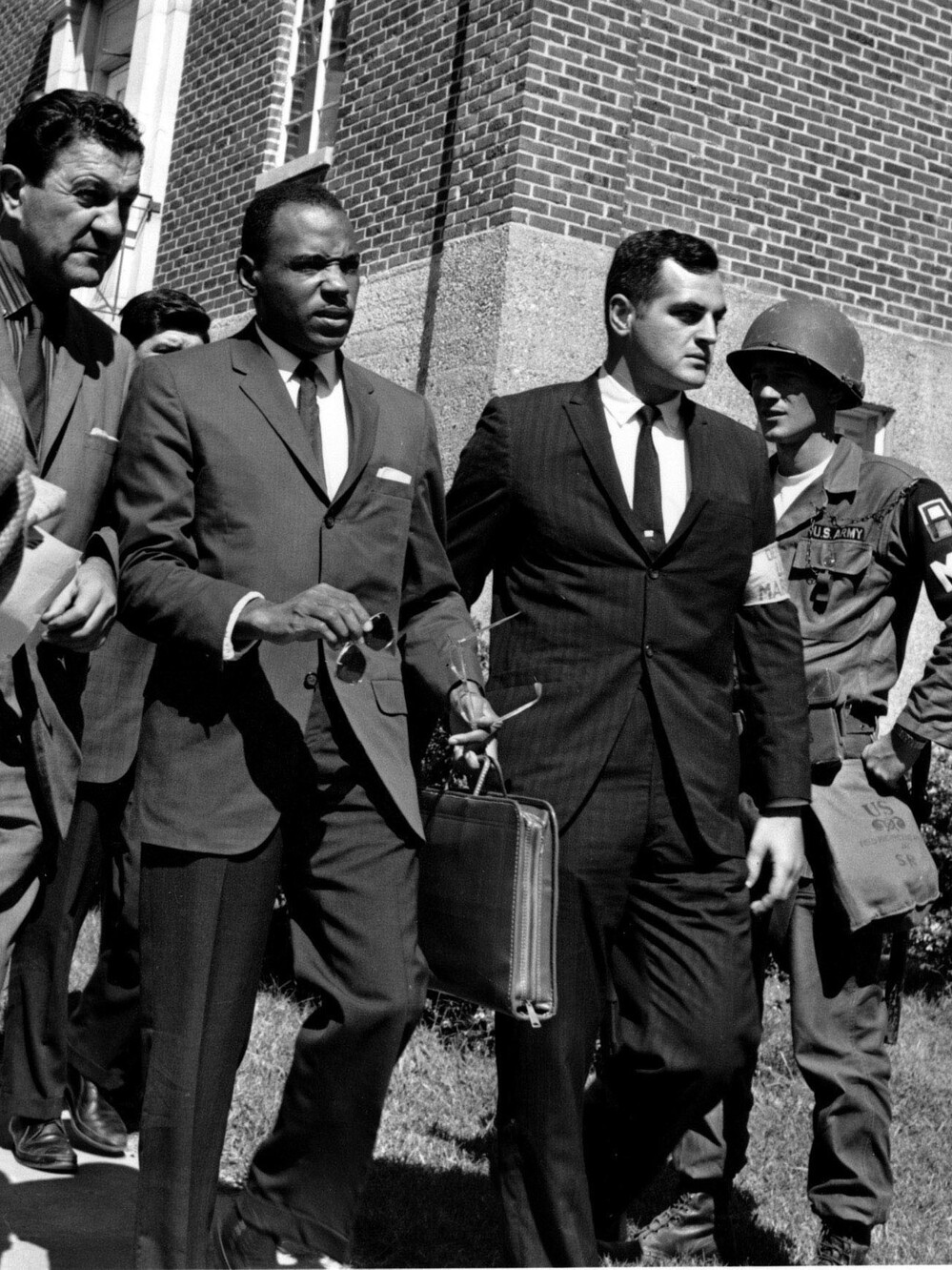 James Meredith is escorted by U.S. Marshals. A riot broke out in 1962 when Meredith tried to enroll at the University of Mississippi.