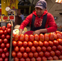 A worker separates tomatoes at a market in Mexico City. The Commerce Department says it might act to end a 16-year-old trade deal governing fresh Mexican tomatoes sold in the U.S. A worker separates tomatoes at a market in Mexico City. The Commerce Department says it might act to end a 16-year-old trade deal governing fresh Mexican tomatoes sold in the U.S.