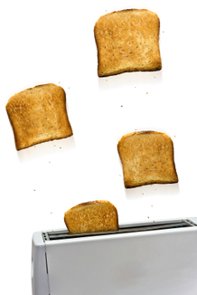 Toast flying out of a toaster. Toast flying out of a toaster.