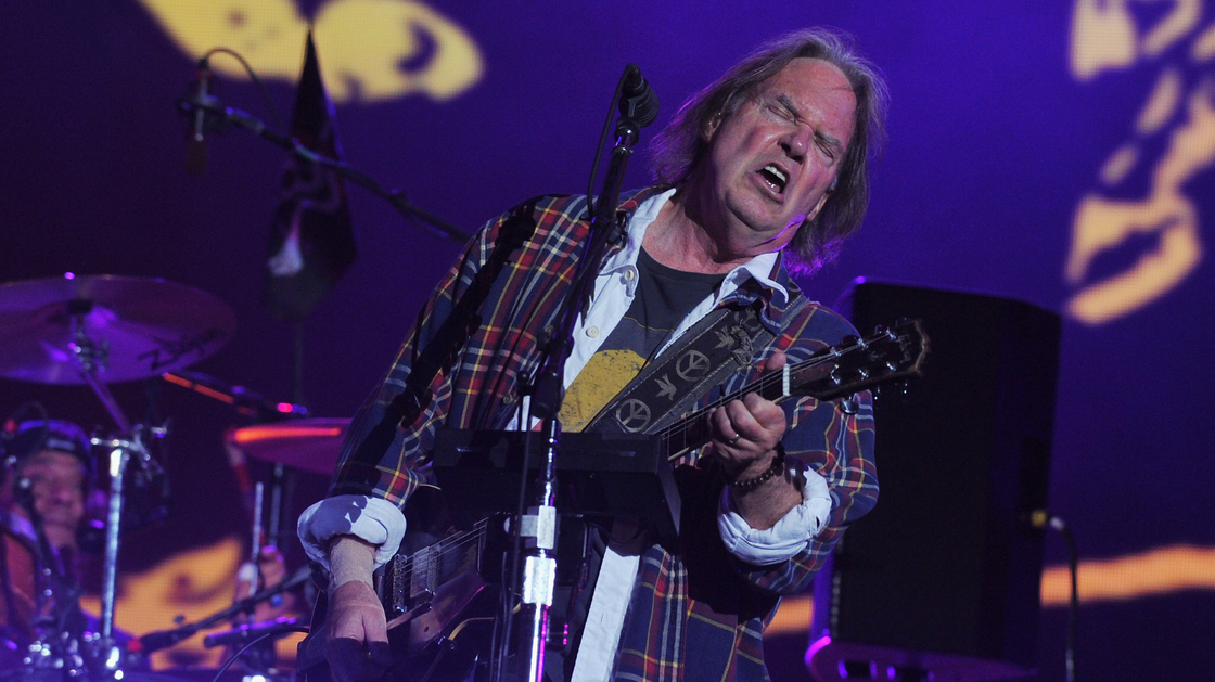 Neil Young onstage at the Global Citizen Festival in Central Park on Saturday. Guitar face.