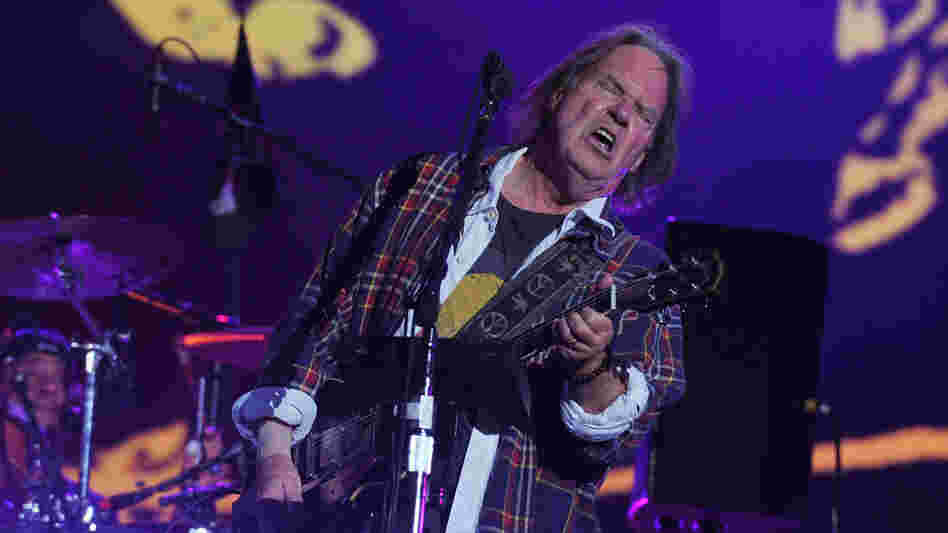 Neil Young onstage at the Global Citizen Festival in Central Park on Saturday. Guitar face.