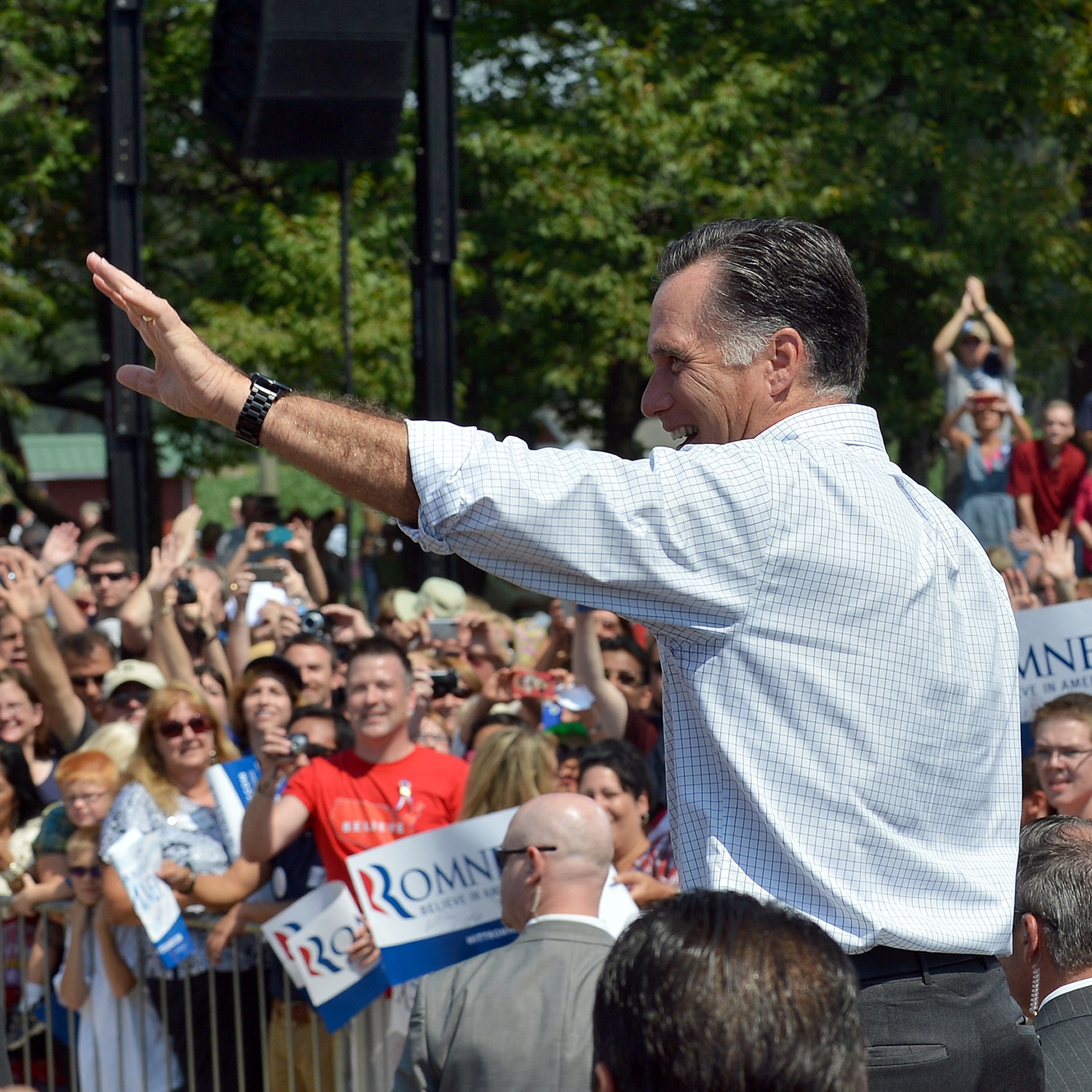 US Republican presidential candidate Mitt Romney (R) and his running mate Paul Ryan wave to supporters during a campaign event in Commerce, Michigan, on August 24, 2012.