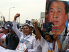 Supporters of Cambodian journalist Mam Sonando protest outside a Phnom Penh courthouse on Monday, when judges sentenced him to 20 years in jail for leading an alleged secession movement. Critics say the pro-democracy activist's case was politically motivated. Supporters of Cambodian journalist Mam Sonando protest outside a Phnom Penh courthouse on Monday, when judges sentenced him to 20 years in jail for leading an alleged secession movement. Critics say the pro-democracy activist's case was politically motivated.