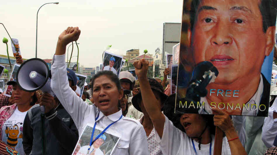 Supporters of Cambodian journalist Mam Sonando protest outside a Phnom Penh courthouse on Monday, when judges sentenced him to 20 years in jail for leading an alleged secession movement. Critics say the pro-democracy activist's case was politically motivated. Supporters of Cambodian journalist Mam Sonando protest outside a Phnom Penh courthouse on Monday, when judges sentenced him to 20 years in jail for leading an alleged secession movement. Critics say the pro-democracy activist's case was politically motivated.